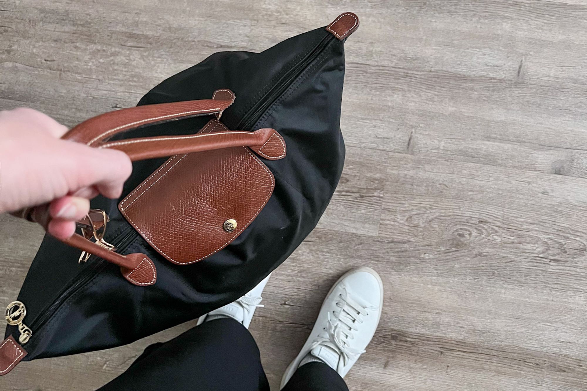Flying Avelo for the First Time? 13 Insider Tips You Need to Know Before You Book Alyssa carries a Longchamp bag