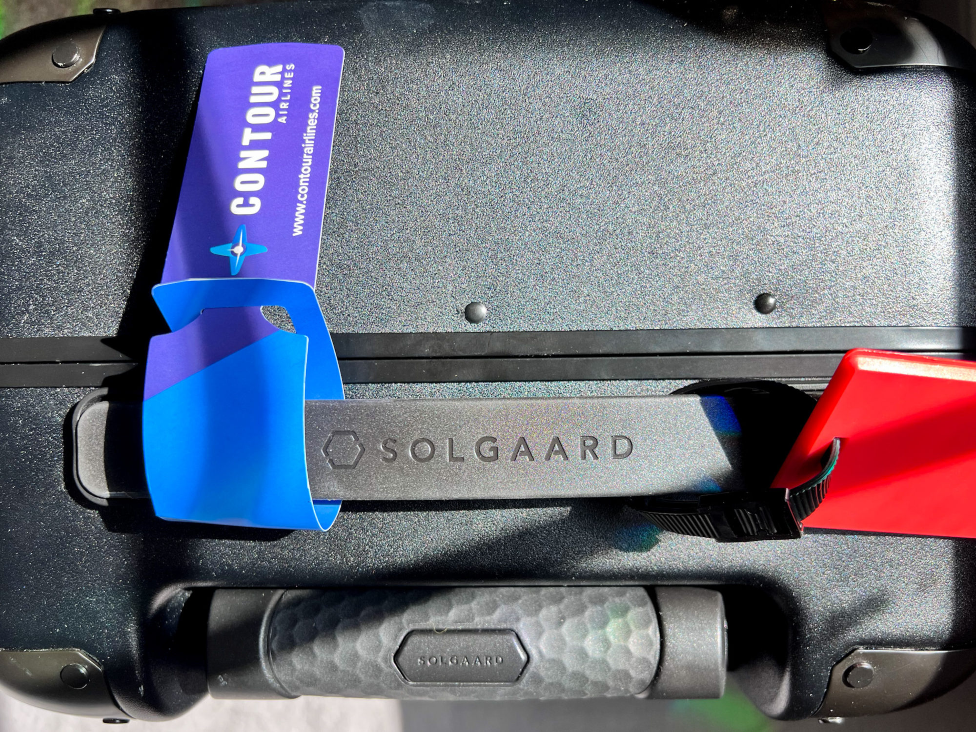 Flying Contour Airlines for the First Time? Here Are 10 Essential Tips You Need to Know Solgaard suitcase with Contour luggage tag