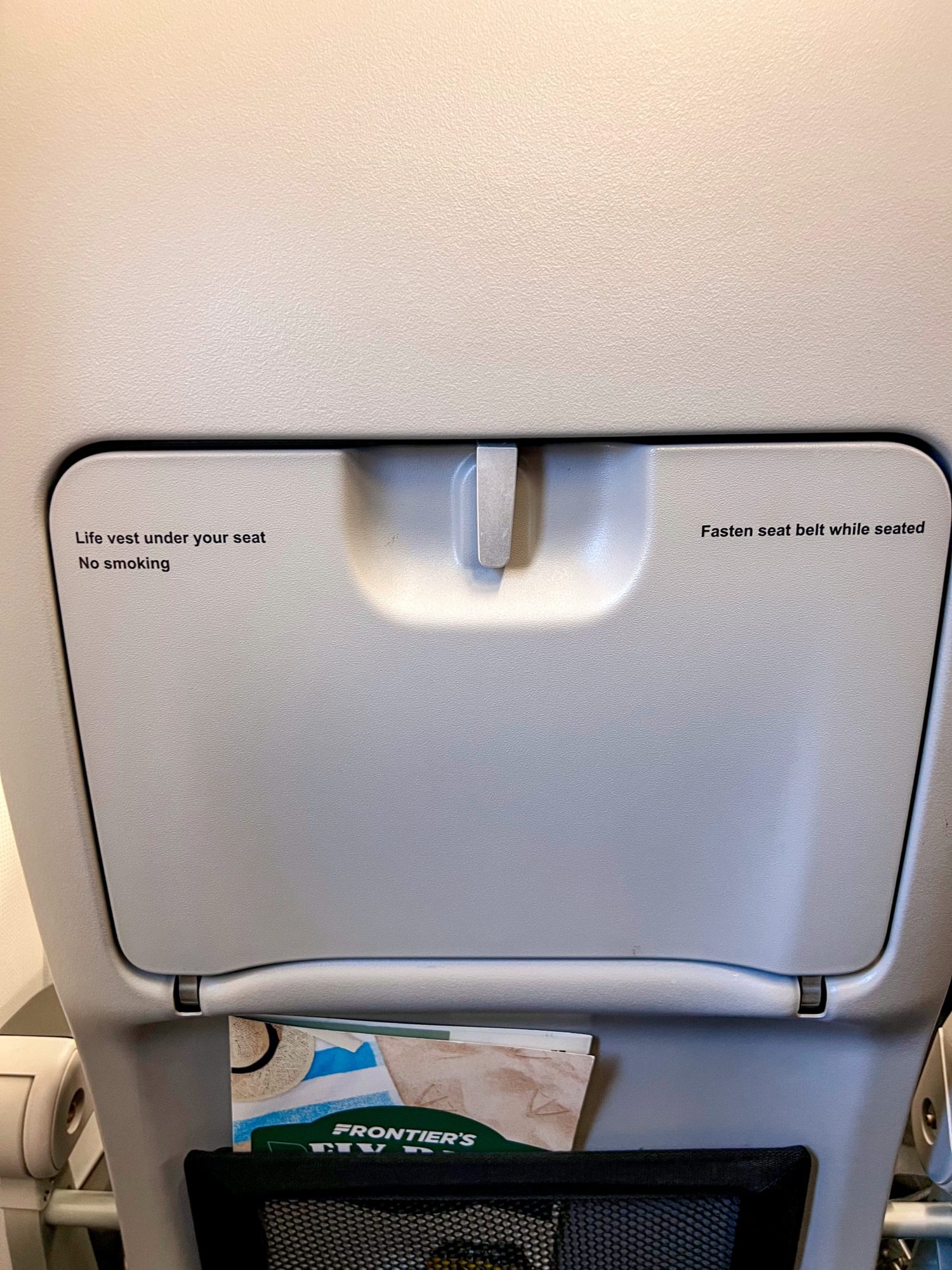 14 Must-Know Tips Before Flying Frontier Airlines Frontier Airlines menu and tray table