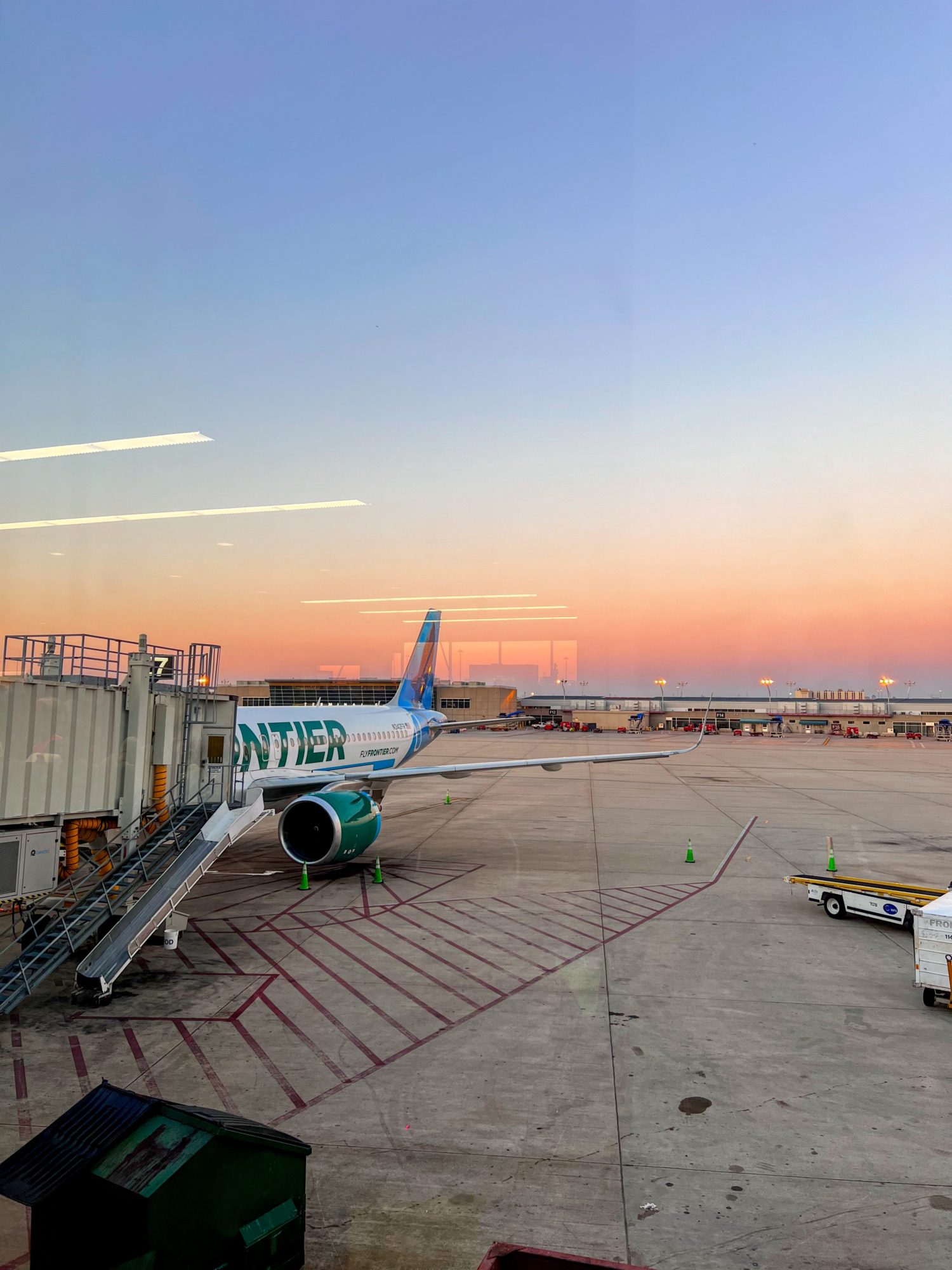 14 Must-Know Tips Before Flying Frontier Airlines Frontier plane at sunset